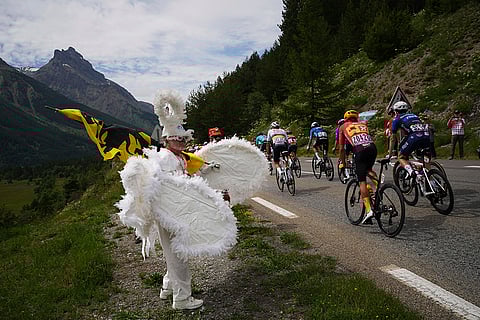 Spectator watches the riders during Tour De France 2024 Stage 4